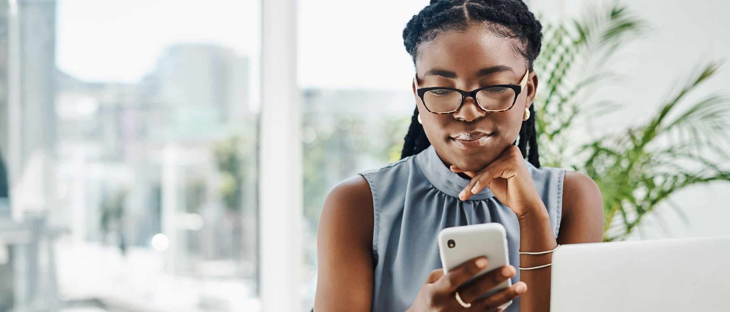 IT Direct Hire recruiter looking at cellphone