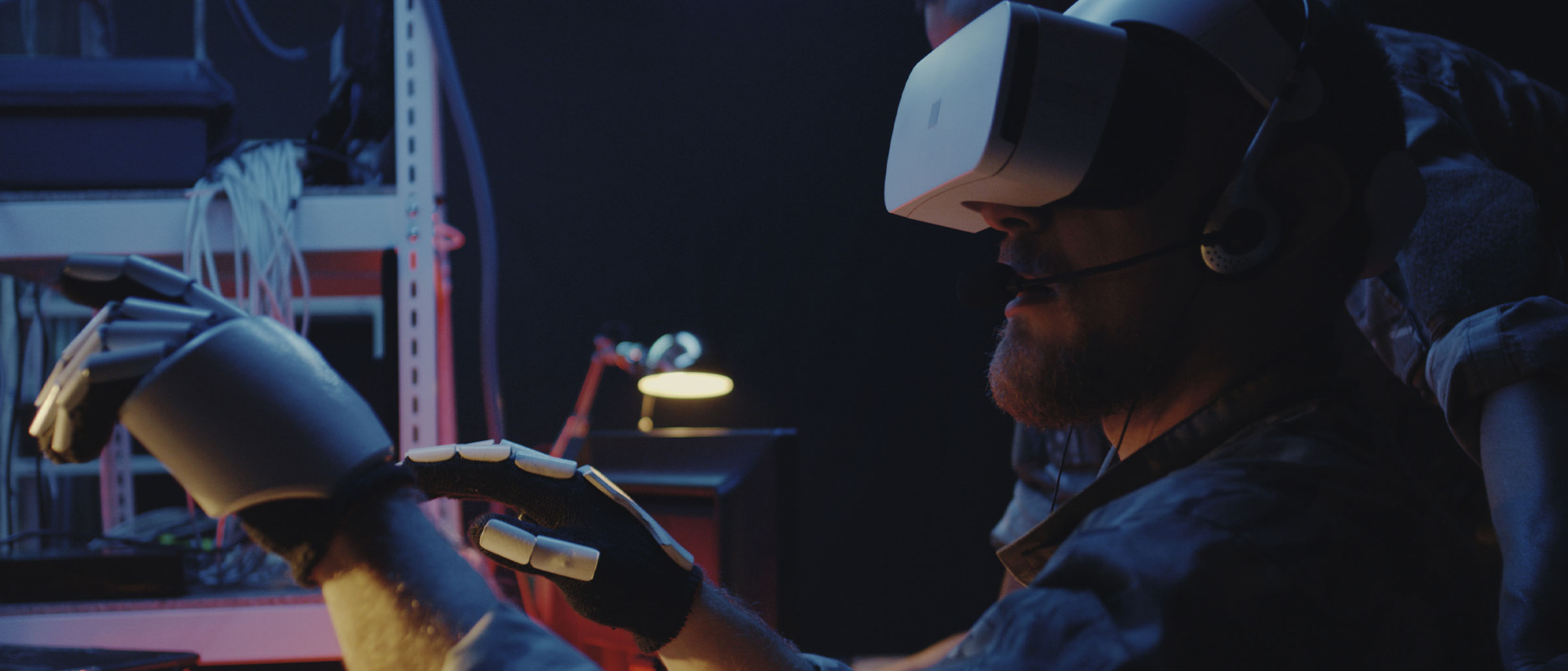 Man wearing virtual reality headset and glove controller