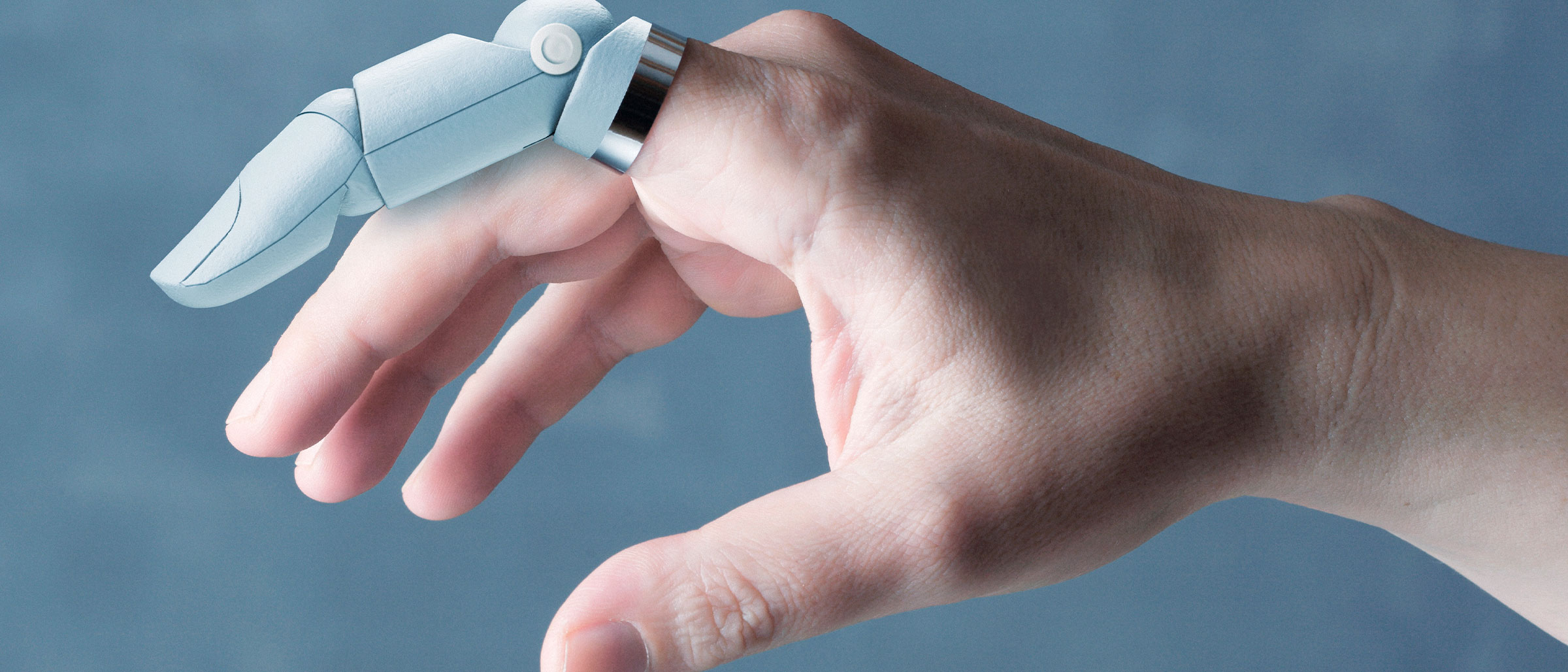 Human hand with one robotic finger