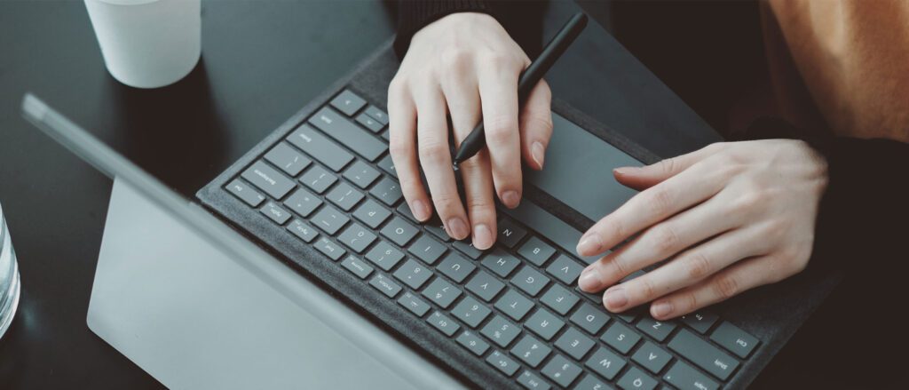 Person typing on tablet keyboard