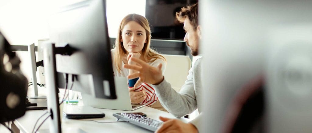 Man and woman strategizing cloud planning