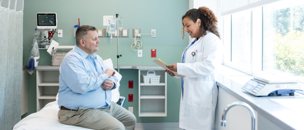 Healthcare professional helping patient in medical office