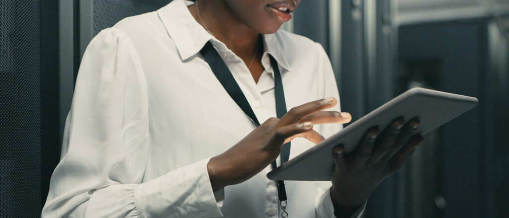 Man holding tablet, typing